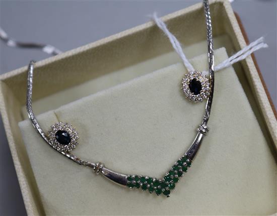 A 9ct white gold and emerald-set pendant on chain and a pair of 9ct gold diamond and sapphire stud earrings.